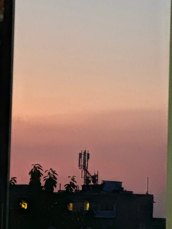 Vratsa sunset views and a tabby cat on a tiled floor