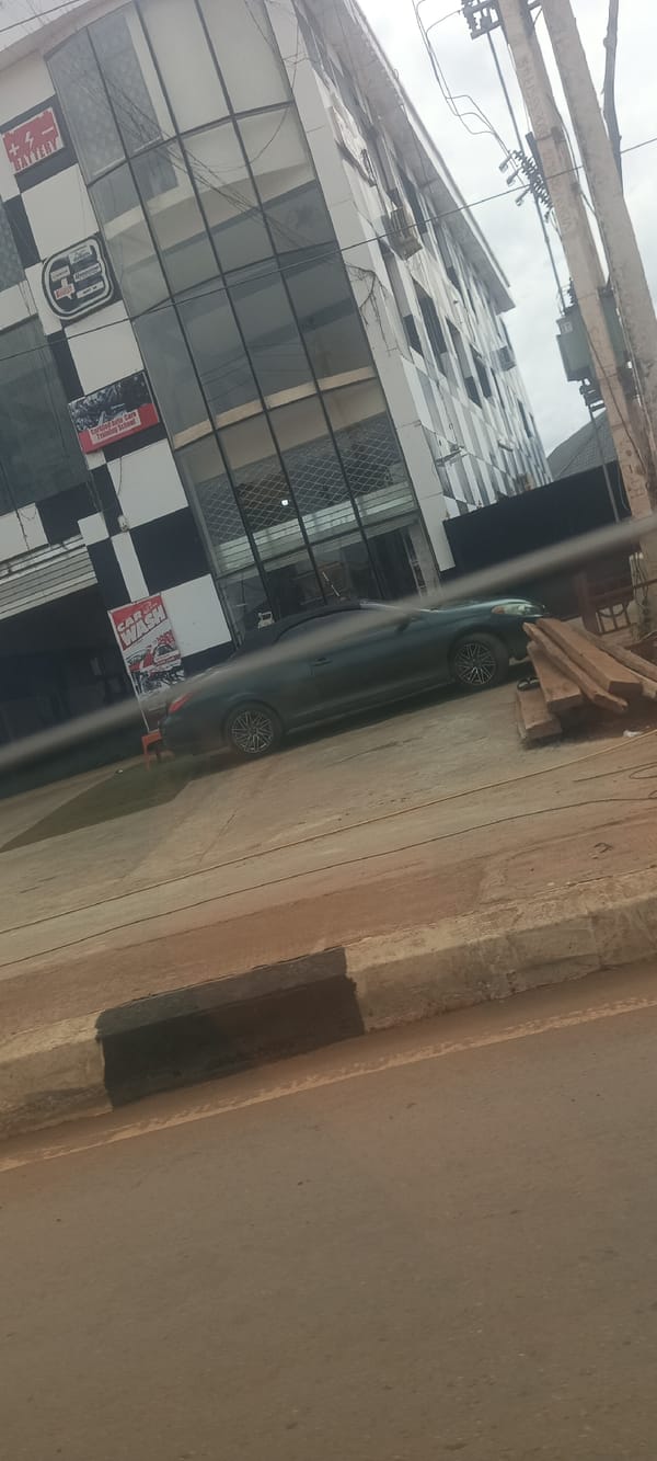 Daily street life captured in commercial Enugu neighborhood