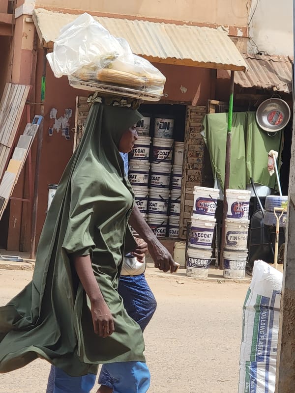 Daily life unfolds on Maiburiji streets during midday hours