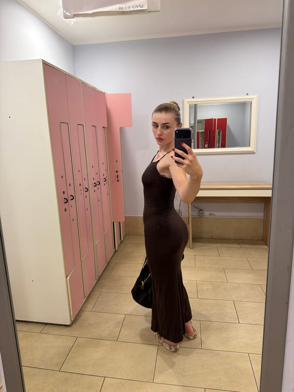 Locker room mirror selfie in a brown maxi dress