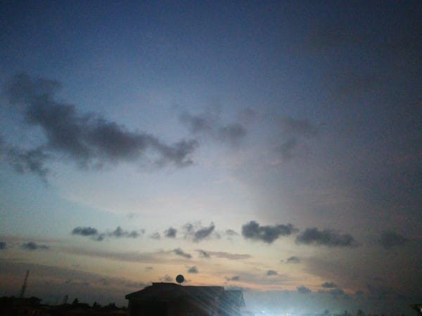 Evening cityscape captured in Lagos under partly cloudy skies