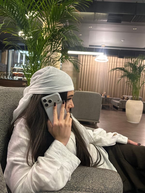 Woman makes phone calls during casual evening in Tsakhkadzor