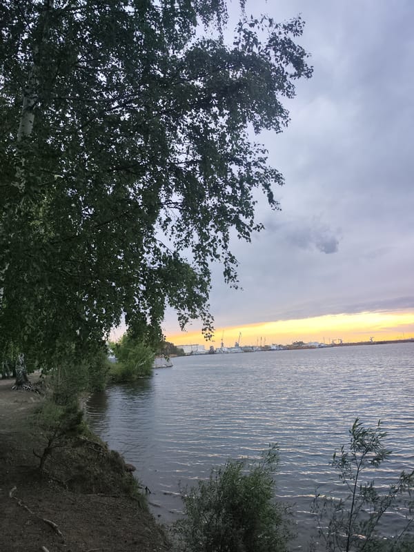 Twilight waterfront scenes captured along Kama River in Chaikovsky, Russia