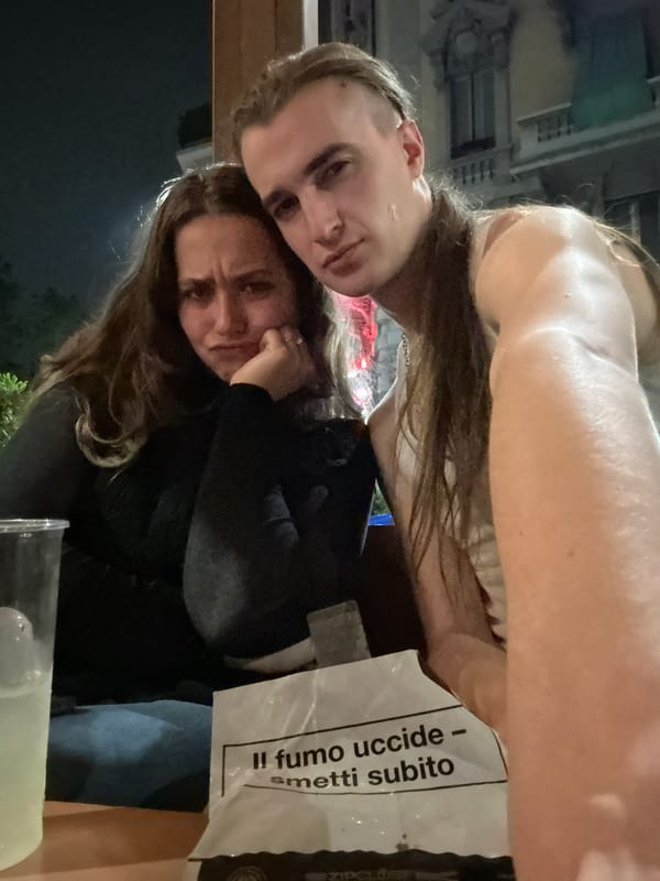 Two people pose for photo in Milan