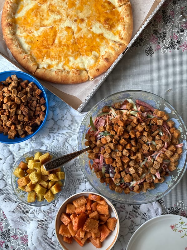 Meal documented with pizza, salad, beer in Ust-Ilimsk