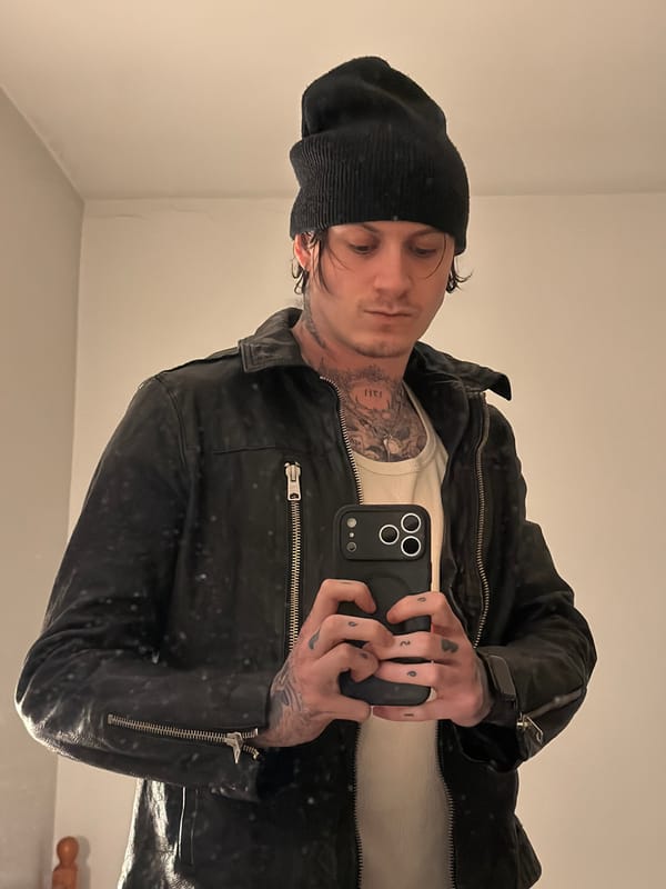 Man takes selfie in London wearing leather jacket