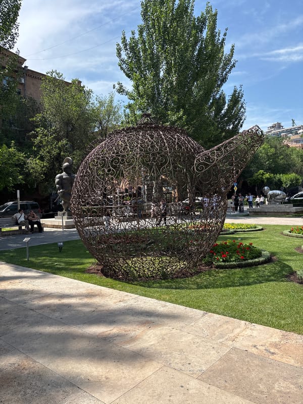 Tourist documents sculptures and fountains at Yerevan's Cascade complex