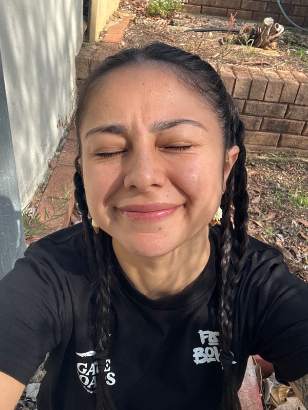 Person in headphones observed outdoors in Bicton, Australia