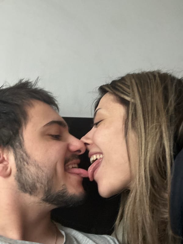 Intimate moments captured in Sofia: couple's kiss, purple tulips