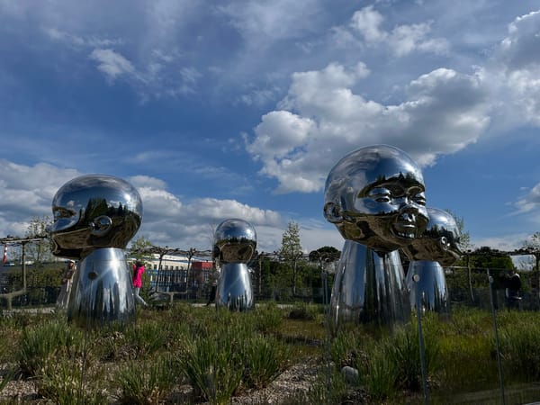 Reflective head sculptures draw visitors in Krasnodar park