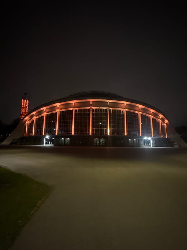 Tallinn Song Festival Grounds illuminated orange at night