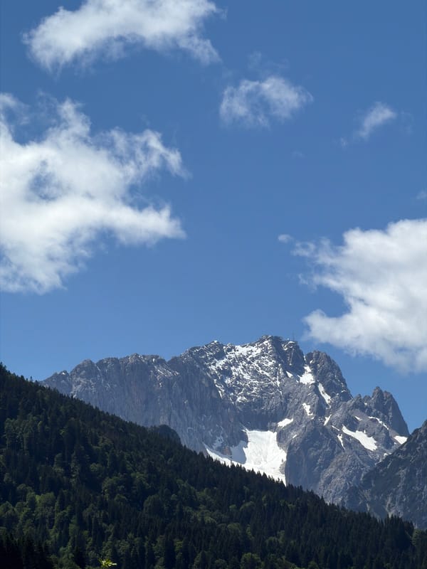 Tourist documents Alpine scenery and ski jump in Garmisch-Partenkirchen