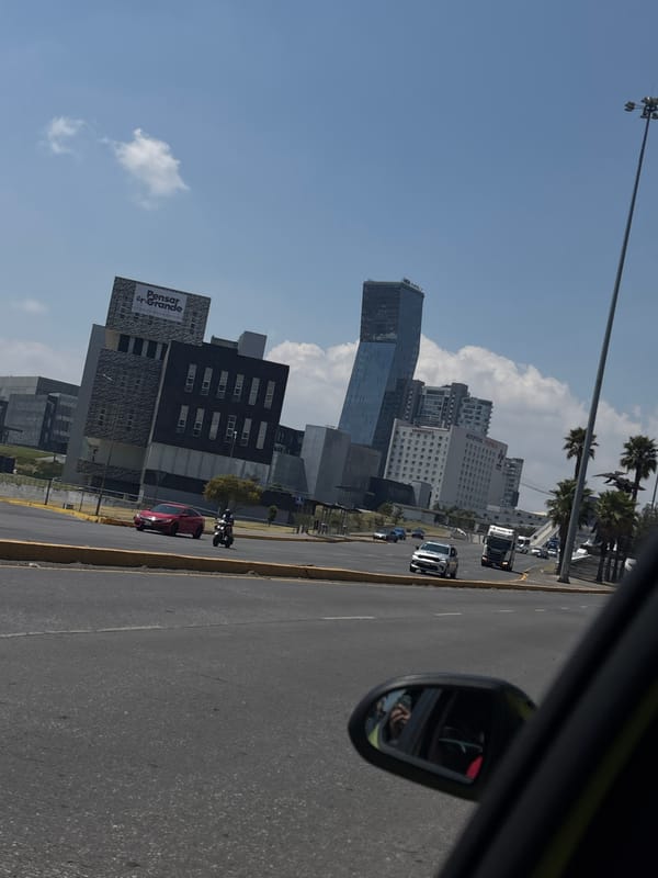 Street view captured of Puebla cityscape from moving car
