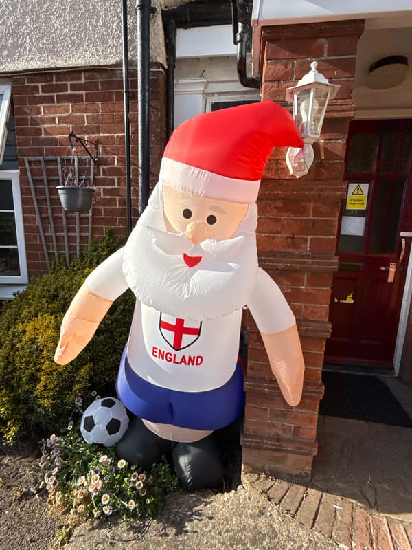 Inflatable Santa suits up in England kit outside Great Yarmouth home