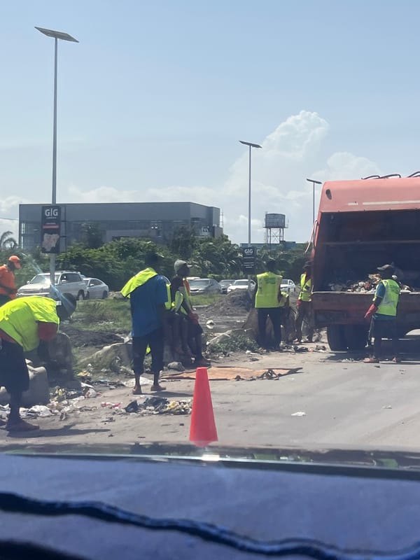 Municipal workers conduct street cleaning operations in Lagos