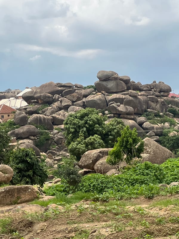 Exploring Jos's rocky hills, streams, and farmland on a quiet morning.
