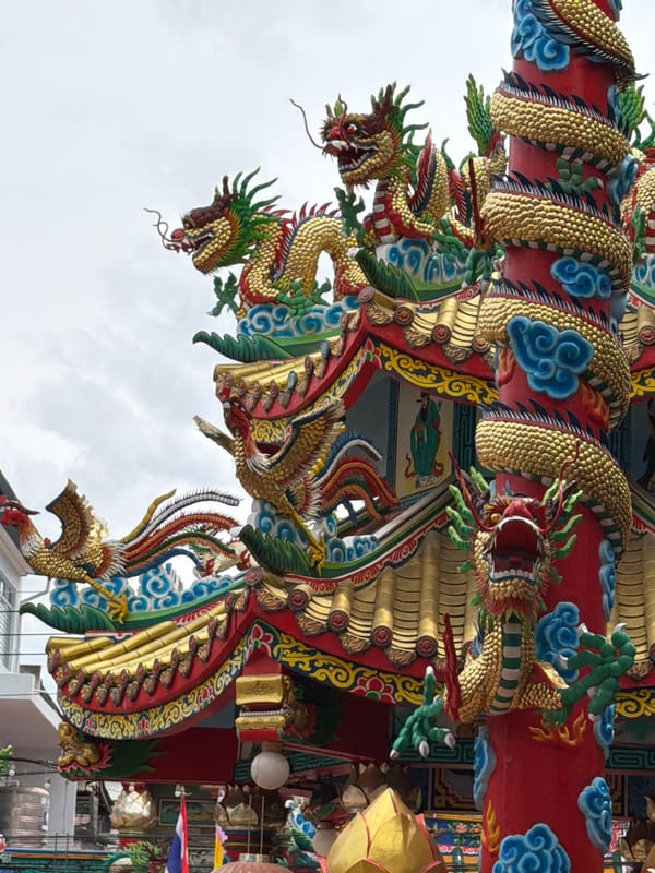 Chiang Mai's ornate Chinese temple district, with flowers nearby