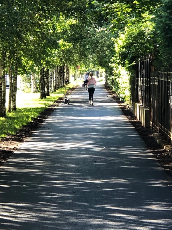 Morning run along a tree-lined path in Saint Petersburg