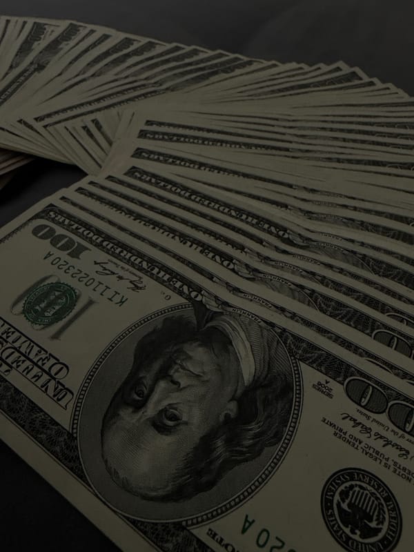 Fanned US cash, $50s and $100s, photographed multiple times in Vinnytsia