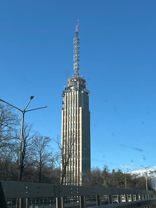 Urban tower and mountain landscape documented by witnesses