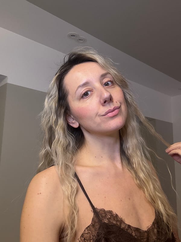 Woman takes mirror selfie indoors in Carnikava, Latvia