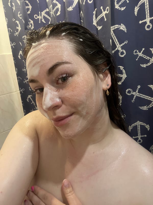 Woman documents morning skincare routine in Chaikovsky bathroom