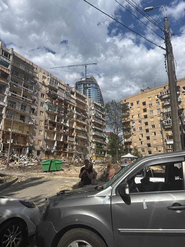 Kyiv residential buildings hit, debris and burnt cars fill the streets