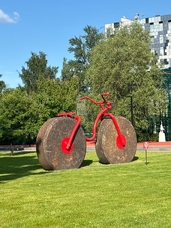 Modern park visit with red metal sculptures in Saint Petersburg
