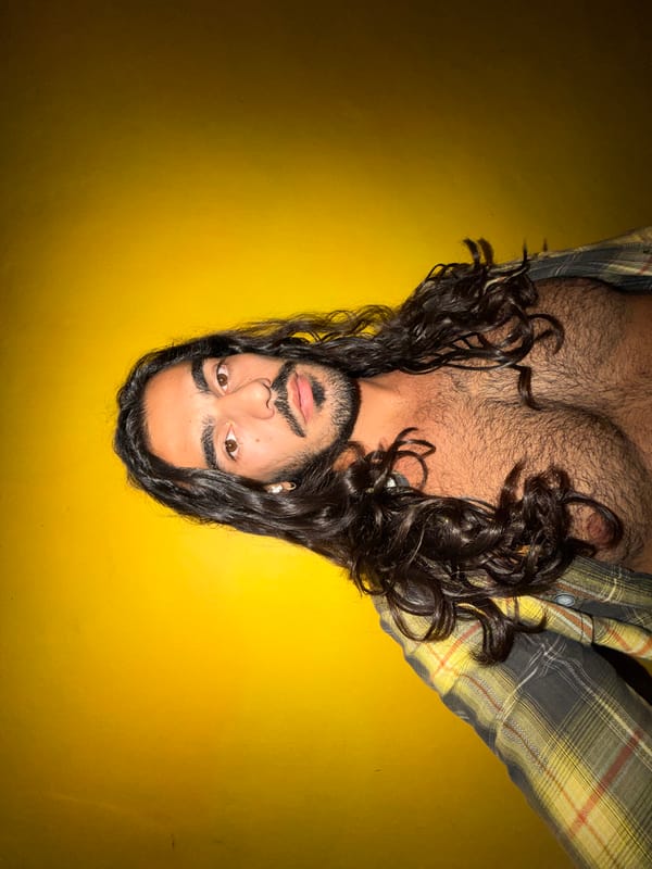 Man takes selfie series against yellow wall in Bali