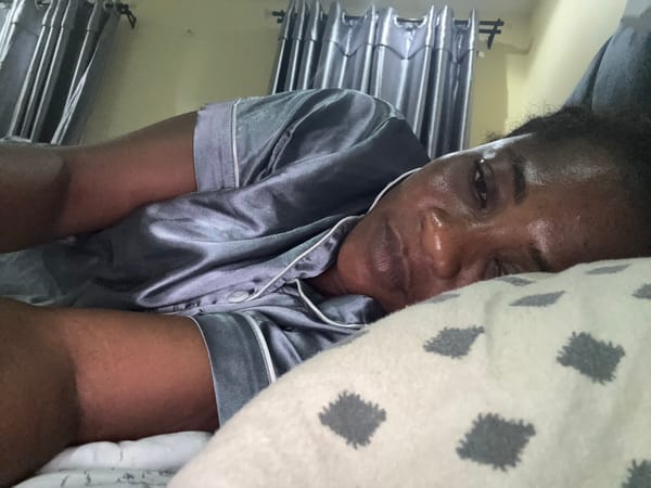 Person in grey pajamas photographed lying down in Ajara