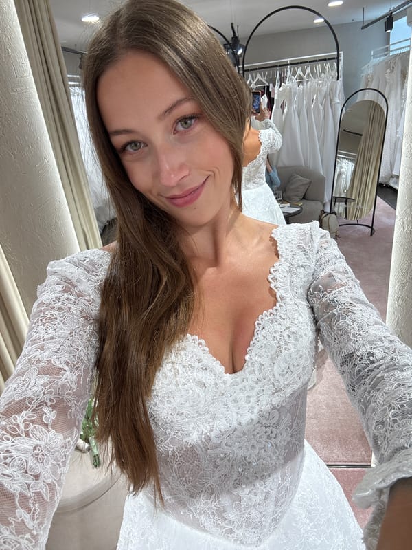 Woman tries on wedding dress at Saint Petersburg bridal shop