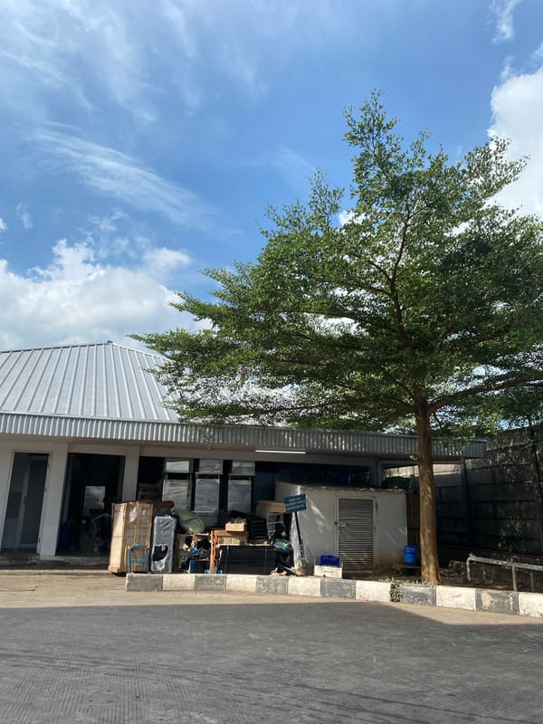 Inside the perimeter of an industrial compound in Gambut Barat