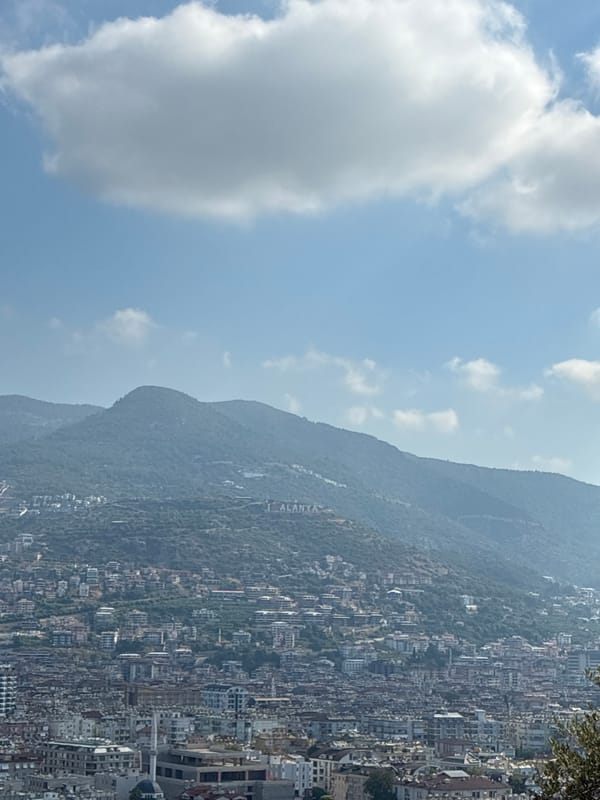 Morning views over Alanya's hillside cityscape from an elevated terrace
