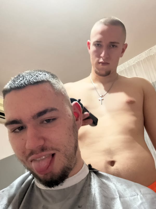 Two men interact with black object in Yambol