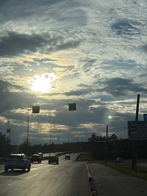 Highway drive through Perm under a dramatic sky