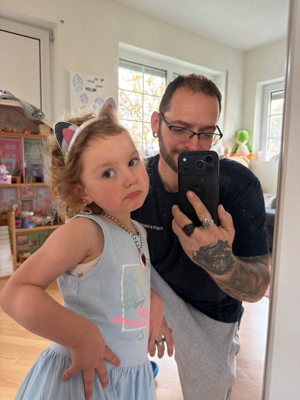 Adult, child take selfie at home in Trassem