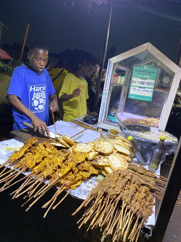 Evening street food and shop activity documented in Rido