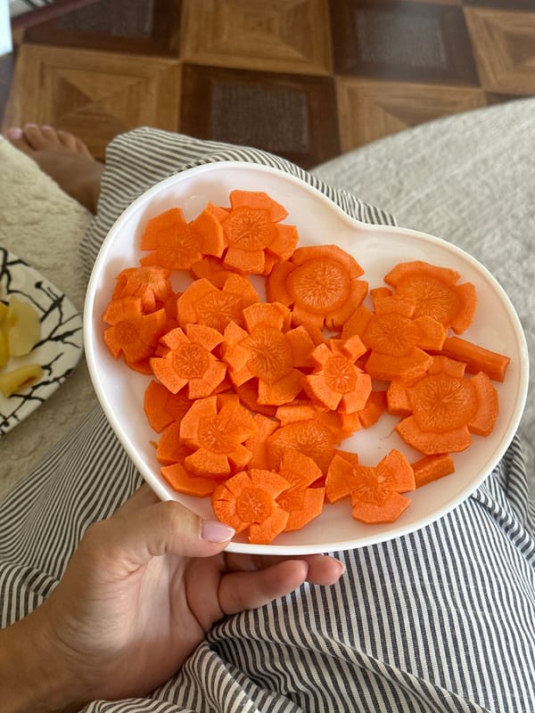 Morning cooking session features decorative carrots and pancakes