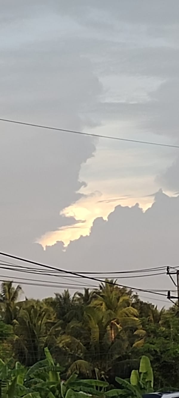 Overcast skies give way to sunset in Indonesian village