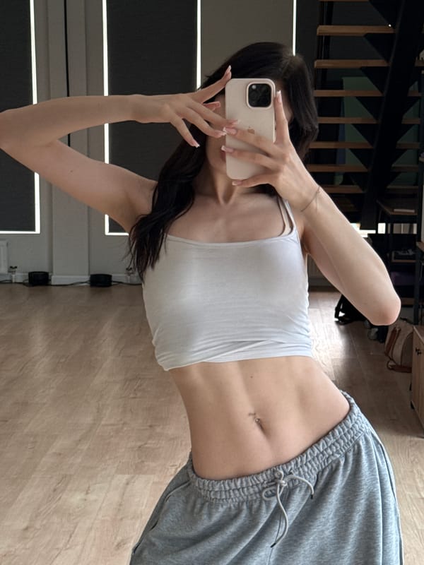 Mirror selfie session at a Zakharovo apartment, June 2026