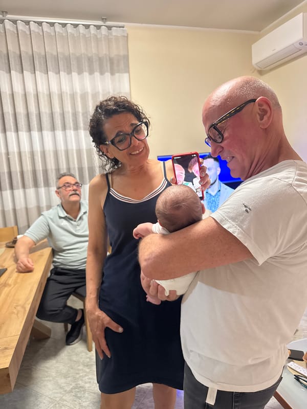Family celebrates new baby with pizza gathering in Aprilia