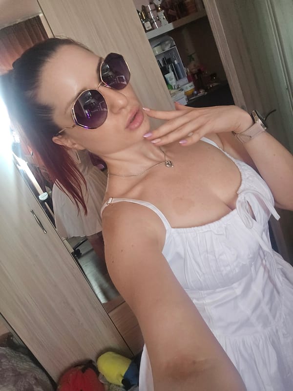 Selfie session in a Burgas room, purple shades and white dress