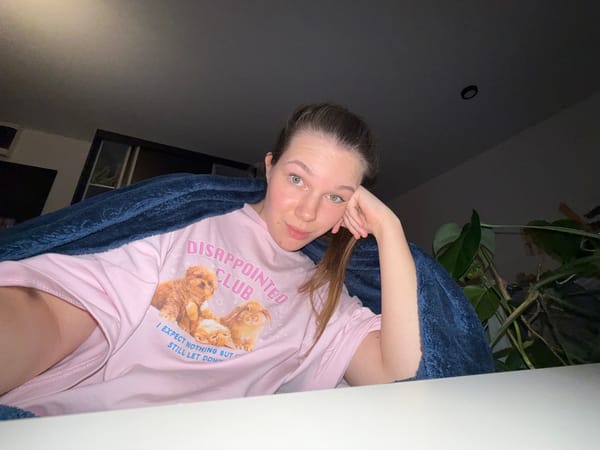 Person takes selfies in pink cat shirt in Belgrade