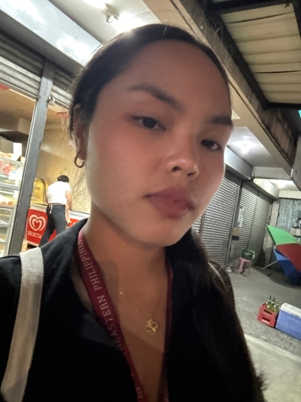 Woman takes selfie wearing Eastern Philippines strap in Davao