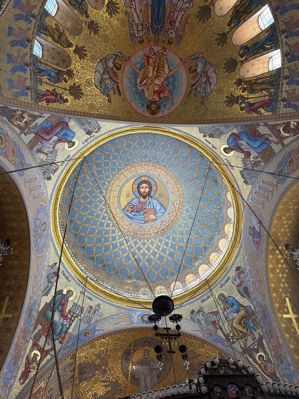 Visitor documents ornate Byzantine mosaics in Kronstadt naval cathedral