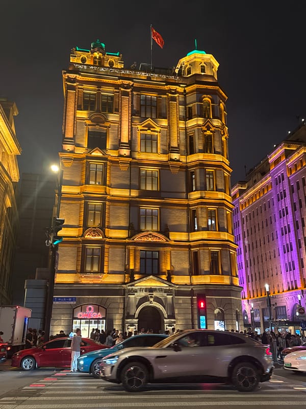 Evening crowds gather at illuminated Shanghai Bund waterfront district