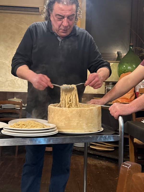 Evening pasta service documented at traditional Roman trattoria