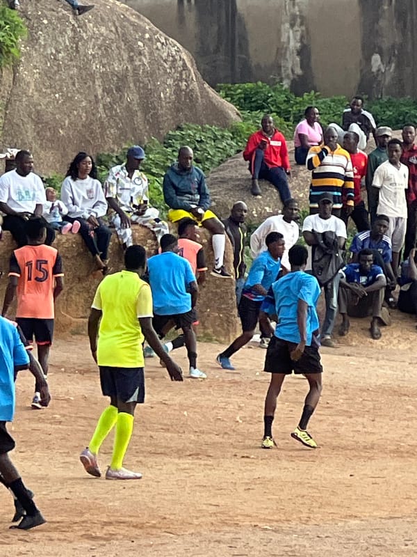 Pickup football on rocky open ground in Jos, Nigeria