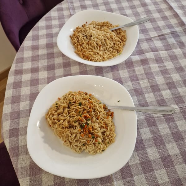 Instant noodle meal documented in Podgorica with social hashtag