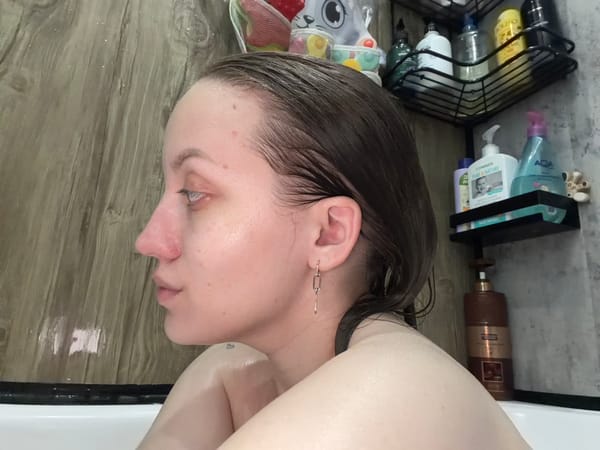 Woman bathing captured in residential bathroom, Reshetnikovo Russia